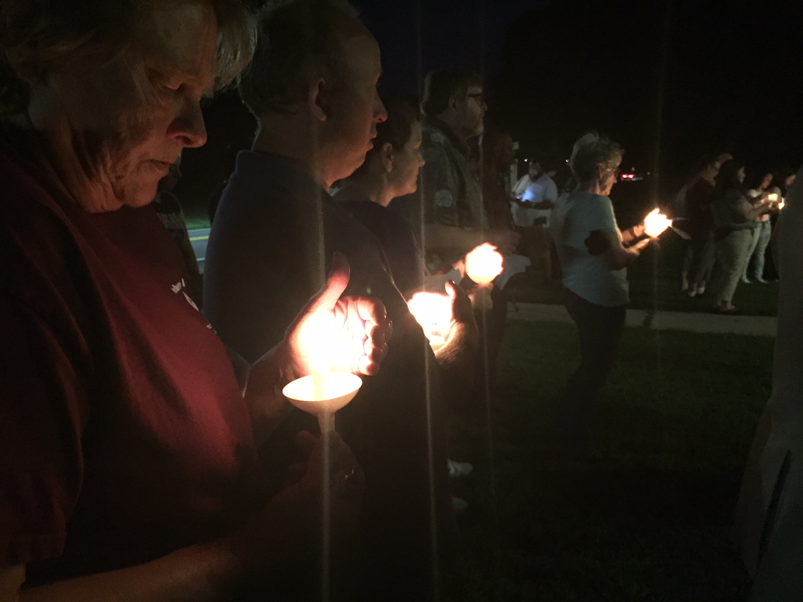Members of the Perryman community participate in a candle-light prayer vigil at Cranberry UMC Sept. 21 following the mass shooting at the Rite Aid Distributoin Center one mile away. Photo by Erik Alsgaard.
