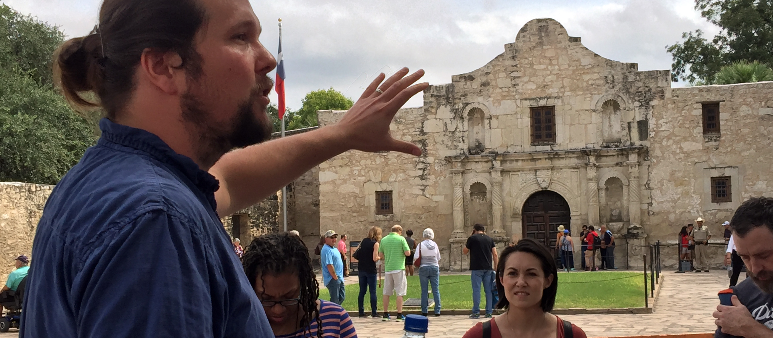 a tour guide talking about the Alamo