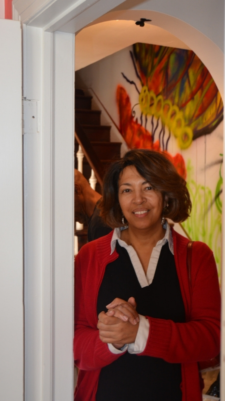 Pastor Lucinda Kent stands in a doorway of the UMC House. Photo by Erik Alsgaard.